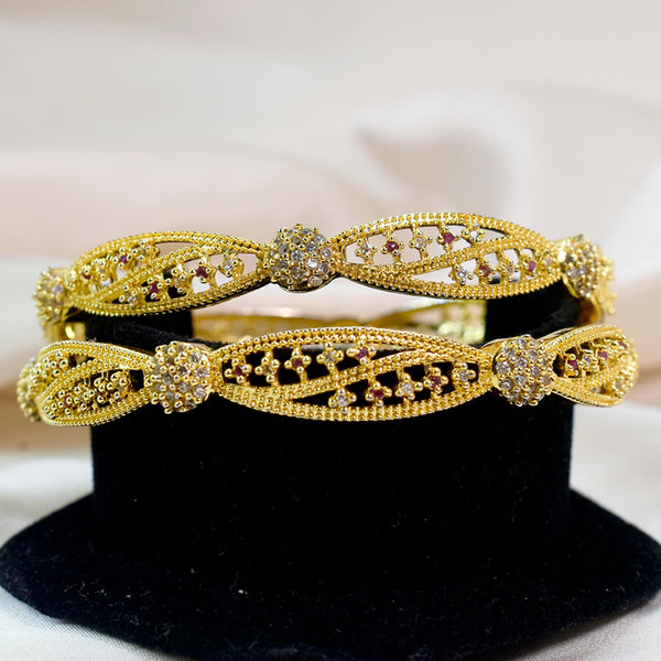 Radiant Sparkle: Golden Bangles with American Diamond Stones