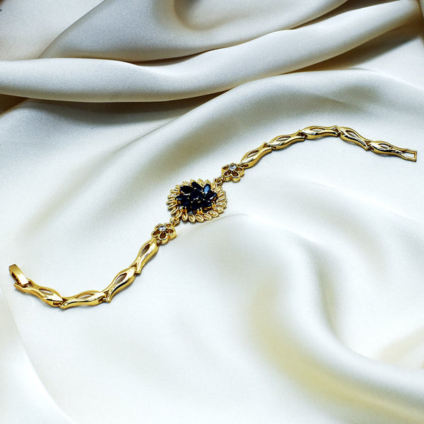 Elegance in Bloom: Gold-Plated Floral Bracelet with Black Gem Accents