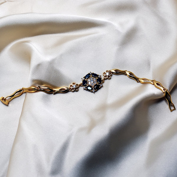 Gold-Plated Floral Bracelet Adorned with Black Gem Accents